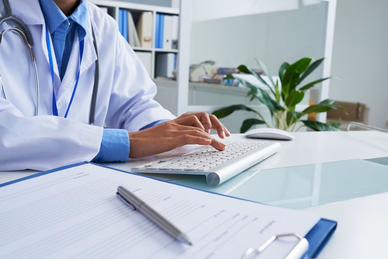 hands-unrecognizable-female-doctor-typing-keyboard-office_1098-20372