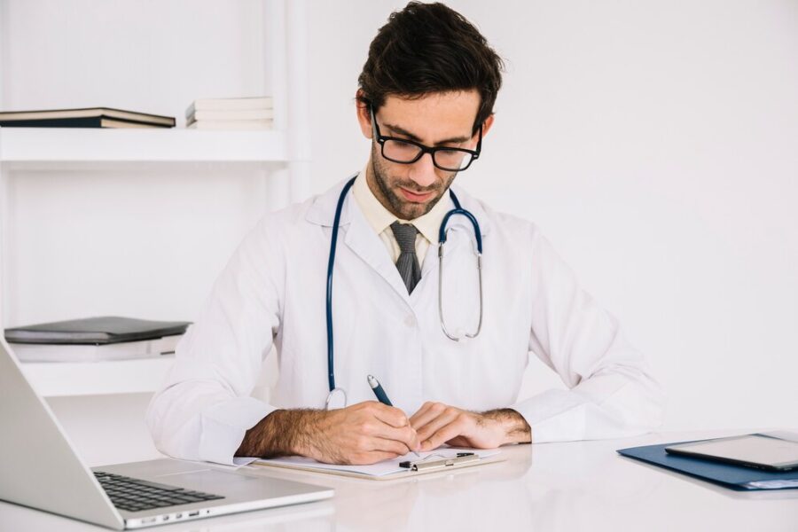 portrait-doctor-writing-clipboard-clinic_23-2147941738